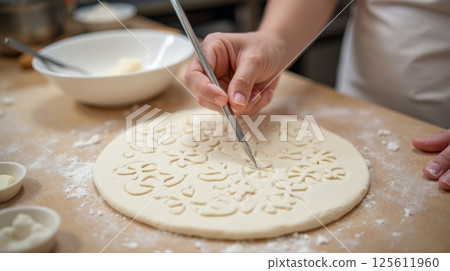 Hand tracing patterns in soft flour creates an artistic culinary Hand tracing patterns in soft flour creates an artistic culinary 125611960