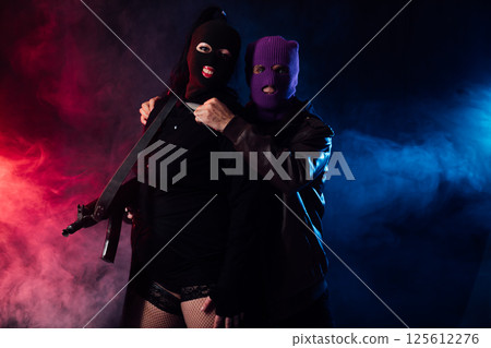 Man And Woman Wearing Mask With Gun 125612276