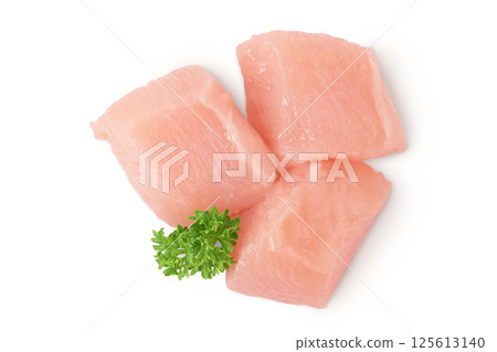 Raw diced chicken fillet isolated on white background. Top view. Flat lay 125613140