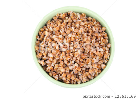 Boiled buckwheat in a ceramic bowl isolated on white background. Top view. Flat lay Boiled buckwheat in a ceramic bowl isolated on white background. Top view. Flat lay 125613169