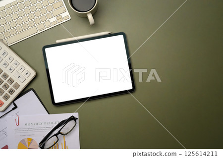 Top view of workspace with digital tablet, financial documents and office accessories Top view of workspace with digital tablet, financial documents and office accessories 125614211
