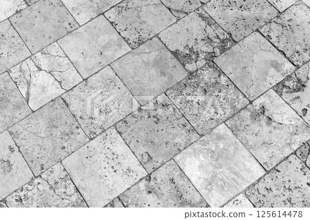 Rustic black and white image of square stone tiles, background texture 125614478