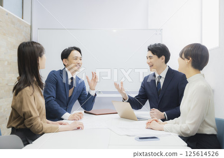 People having a meeting in a conference room 125614526