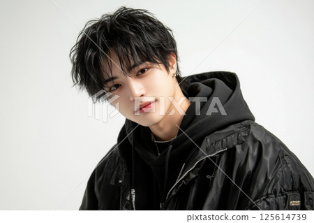 Smiling young Asian man in casual fashion portrait 125614739