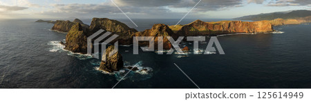 East Coast of Madeira Island - Ponta de Sao Lourenco. Beautiful Ultra Wide Panoramic Aerial Shot. Sunrise Light with Cloudy Sky. 125614949