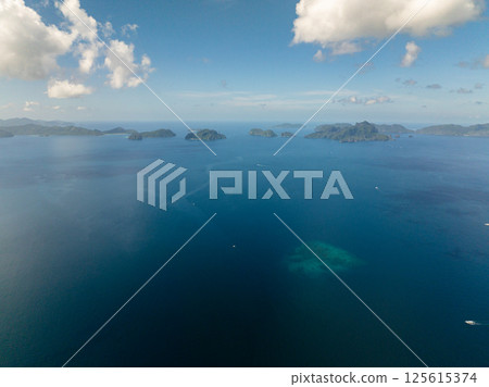 Tropical seascape of Islands surrounded by blue sea. El Nido, Palawan. Philippines. Tropical seascape of Islands surrounded by blue sea. El Nido, Palawan. Philippines. 125615374