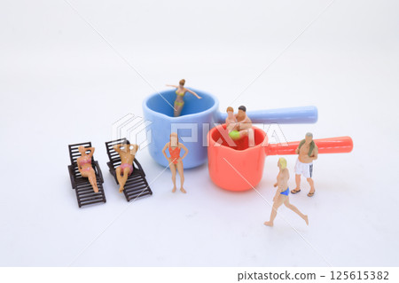 Beach Scene with Figures in Lying Chairs and Colorful Containers 125615382