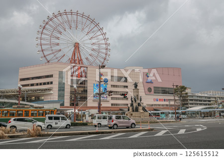 March 24 2025 Modern Ferris Wheel Near a Busy Urban Center and Traffic, Japan 125615512