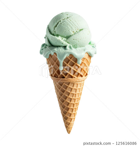 Creamy green mint ice cream in waffle cone, melting slightly, evokes refreshing and delightful treat perfect for warm days. Enjoy sweet, cool flavor that brings joy to every bite. 125616086