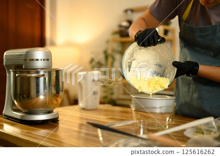 Man carefully handling buttermilk by product after whipping cream 125616262