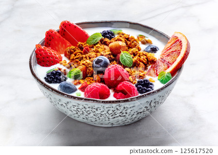 Granola with yogurt and fresh fruit. Organic gourmet muesli Granola with yogurt and fresh fruit. Organic gourmet muesli 125617520