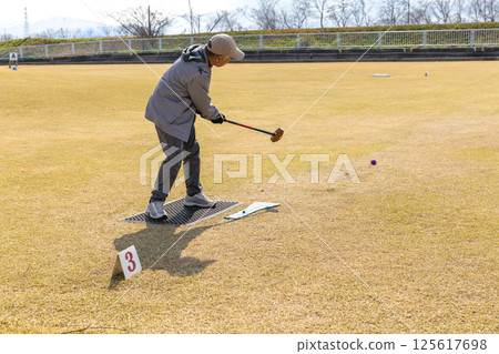 Senior man playing grand golf 125617698