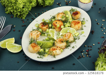Seared scallops on a plate. 125618178