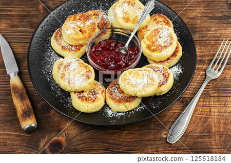 Cottage cheese fritters stack, Syrniki. Cottage cheese fritters stack, Syrniki. 125618184