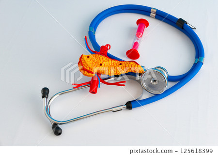 Healthcare and medical concept human pancreas and hourglass 125618399