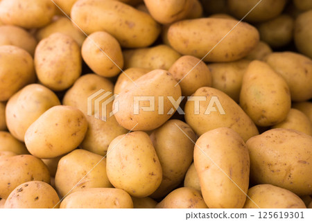 Potatoes on counter in market Potatoes on counter in market 125619301