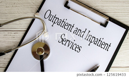 Top view of Outpatient and Inpatient text on clipboard with gavel on top. Medical support concept Top view of Outpatient and Inpatient text on clipboard with gavel on top. Medical support concept 125619433