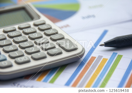 Graph analysis with calculator. Financial analysis concept Graph analysis with calculator. Financial analysis concept 125619438