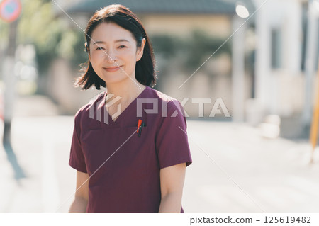 Nurse in her 50s Nurse in her 50s 125619482