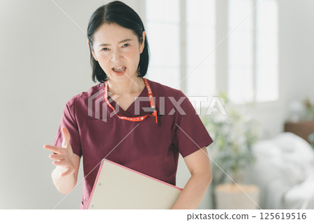 Nurse in her 50s Nurse in her 50s 125619516