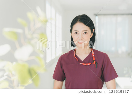 Nurse in her 50s Nurse in her 50s 125619527