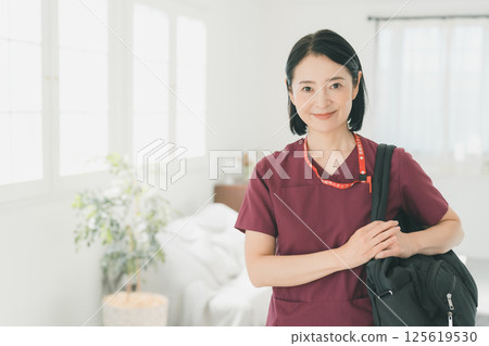 Nurse in her 50s Nurse in her 50s 125619530