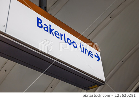 Bakerloo Line sign illuminated inside London Underground station 125620281
