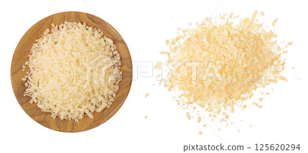 grated parmesan cheese in wooden bowl and scoop isolated on white background. Top view. Flat lay grated parmesan cheese in wooden bowl and scoop isolated on white background. Top view. Flat lay 125620294
