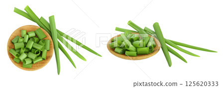 Green onion in wooden bowl isolated on the white background. Top view. Flat lay. Green onion in wooden bowl isolated on the white background. Top view. Flat lay. 125620333