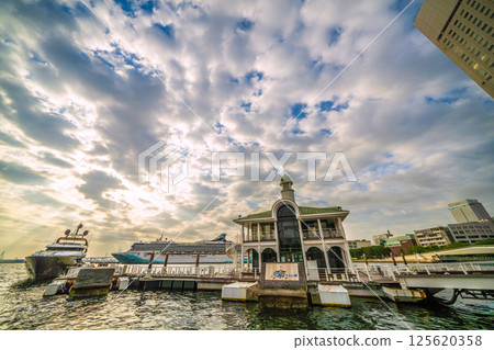 Yokohama cityscape in Japan with two luxury cruise ships, including the Norwegian Spirit and Queen Elizabeth Yokohama cityscape in Japan with two luxury cruise ships, including the Norwegian Spirit and Queen Elizabeth 125620358