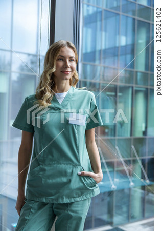 Caucasian doctor in hospital wearing uniform working in healthcare office 125621402