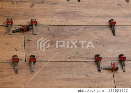 Tile Leveling System Components on The Floor. Closeup, selective focus. 125621852