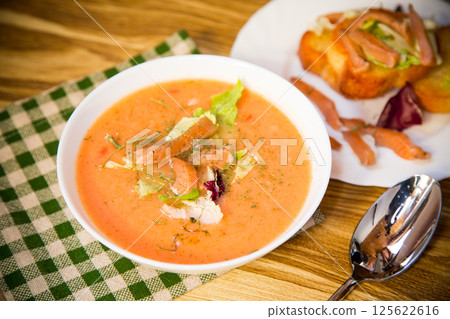 Healthy and delicate cream soup of red fish with dill 125622616