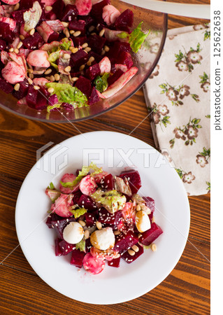 Low calorie salad with boiled beets and mozzarella cheese Low calorie salad with boiled beets and mozzarella cheese 125622638