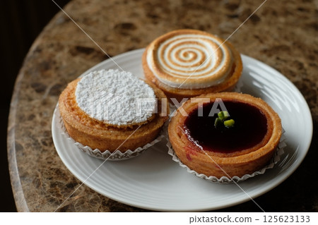 Baked goods: Citron tart, Amandine, Mille d'Amien Baked goods: Citron tart, Amandine, Mille d'Amien 125623133