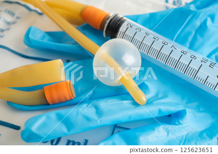 Foley catheter and urine drainage bag collect urine for disability or patient in hospital. 125623651