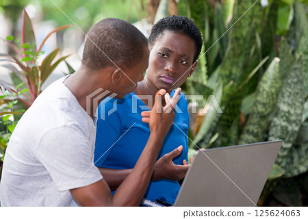 portrait of young students sitting with laptop. 125624063