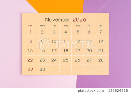 November 2026 calendar brown paper page on purple background. 125624216