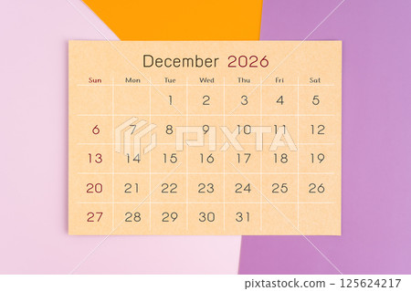 December 2026 calendar brown paper page on purple background. 125624217