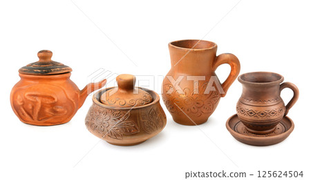 Ceramic pot, jug and clay mug with saucer isolated on white background. Collage. 125624504