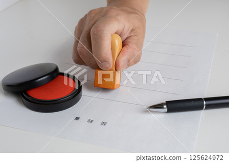 Stamping a real estate contract Stamping a real estate contract 125624972