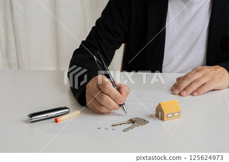 Stamping a real estate contract Stamping a real estate contract 125624973