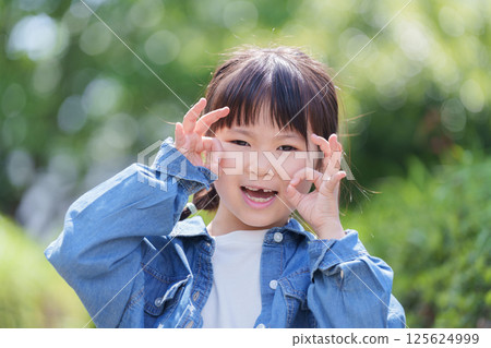 Smiling child saying OK 125624999