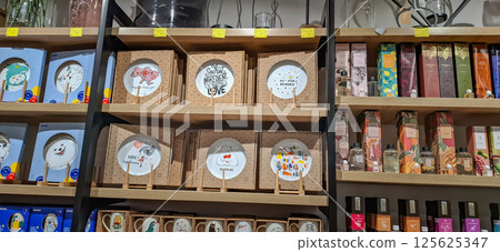 Shop of decorative goods and interior accessories. Exhibition racks with a wide range of interior products. 125625347