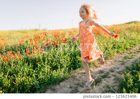 Girl running outdoor countryside. Lifestyle girl with sunshine in field Girl running outdoor countryside. Lifestyle girl with sunshine in field 125625406