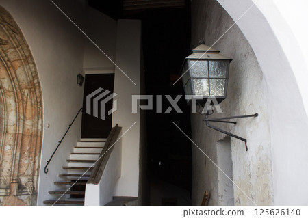 The narrow, medieval street in Rattenberg, Tyrol, Austria, features colorful buildings and historic architecture, showcasing its charm as Austria's smallest town 125626140