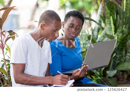 portrait of young students with laptop. 125626427