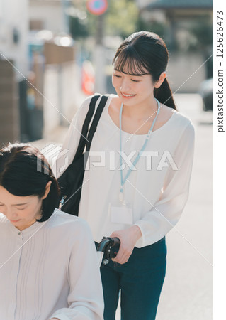 Going out support/helper accompaniment service 125626473