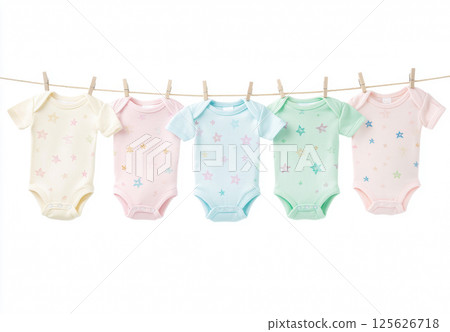 Colorful baby bodysuits with star patterns hanging on a clothesline against a white background. Concept of baby fashion, newborn clothing, laundry day, baby shower, childhood and care. Copy space Colorful baby bodysuits with star patterns hanging on a clothesline against a white background. Concept of baby fashion, newborn clothing, laundry day, baby shower, childhood and care. Copy space 125626718