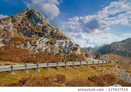 Narrow winding mountain road in National park Picos de Europa. Asturias, Spain, Europe Narrow winding mountain road in National park Picos de Europa. Asturias, Spain, Europe 125627418